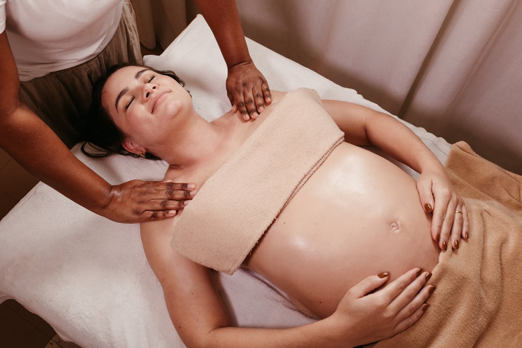 Pregnant woman enjoying a soothing prenatal massage in a spa. Relaxation and pampering at its best.