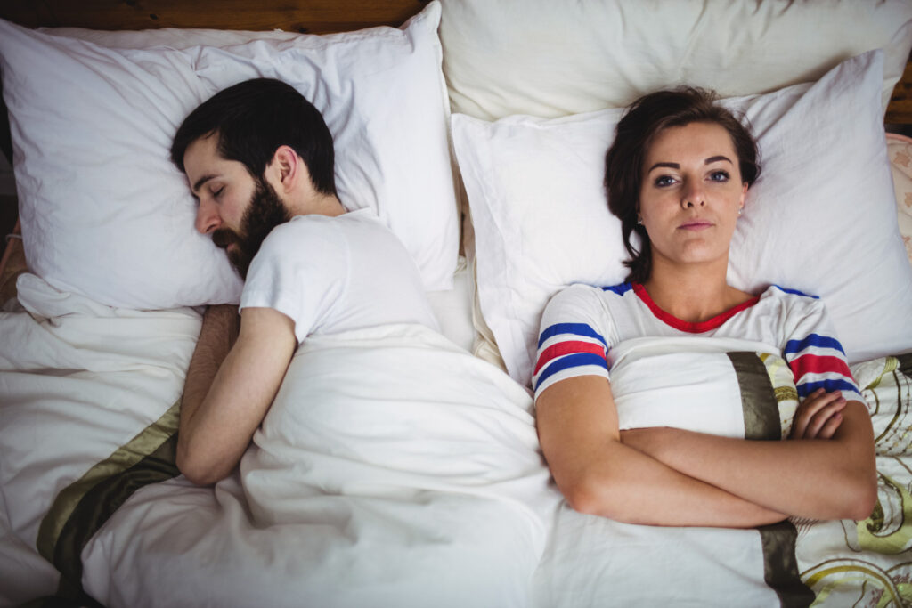 The Psychological Toll of Erectile Dysfunction. women distressed with man in bed